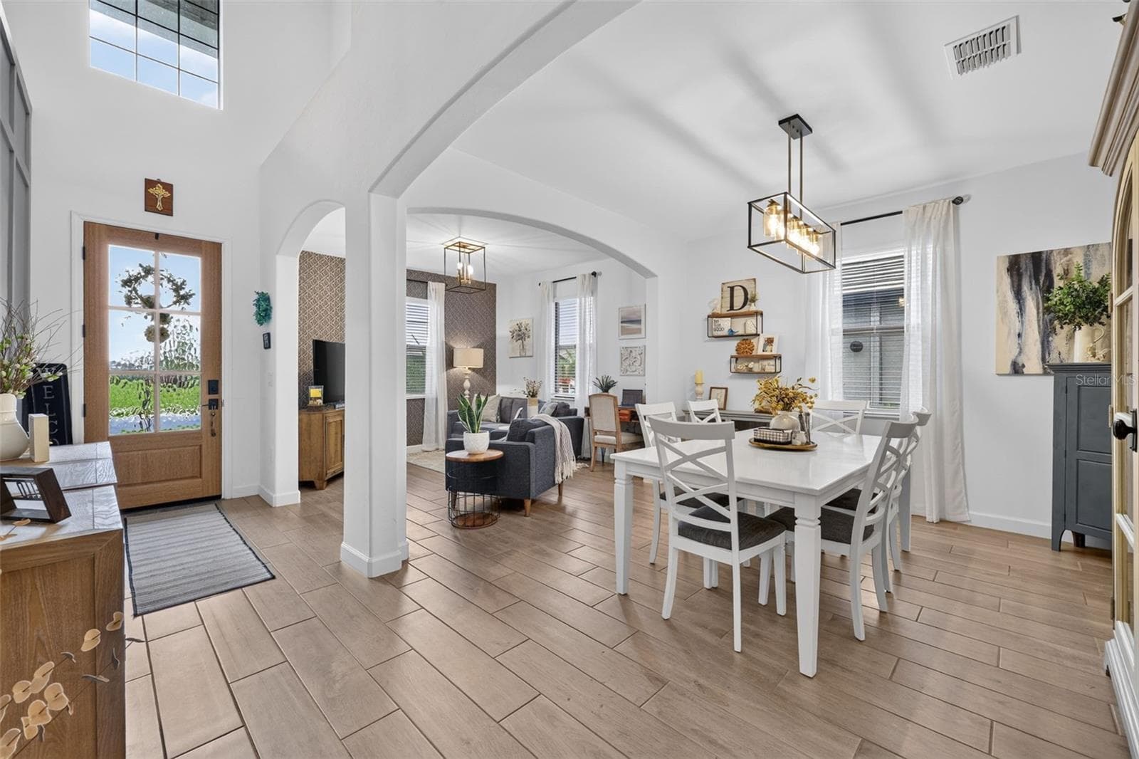 Open Plan Dining Room with Ceramic Wood Plank Tiles - 15008 MISTY WATER XING, BRADENTON