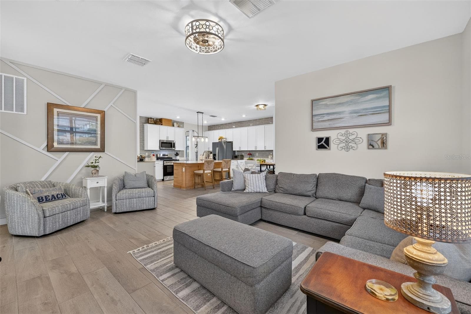 Family Room with Ceramic Wood Plank Tiles and Custom  Accent Wall - 15008 MISTY WATER XING, BRADENTON