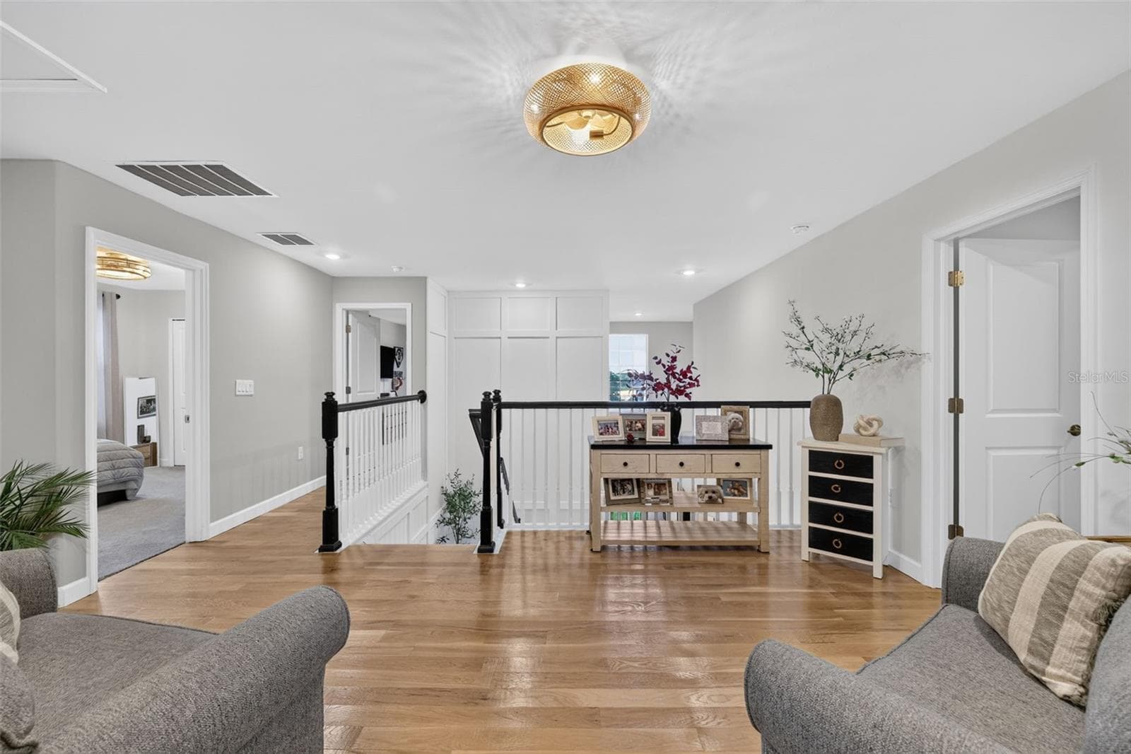 Second Floor Sitting Area with White Oak Flooring and Decorative Insets - 15008 MISTY WATER XING, BRADENTON
