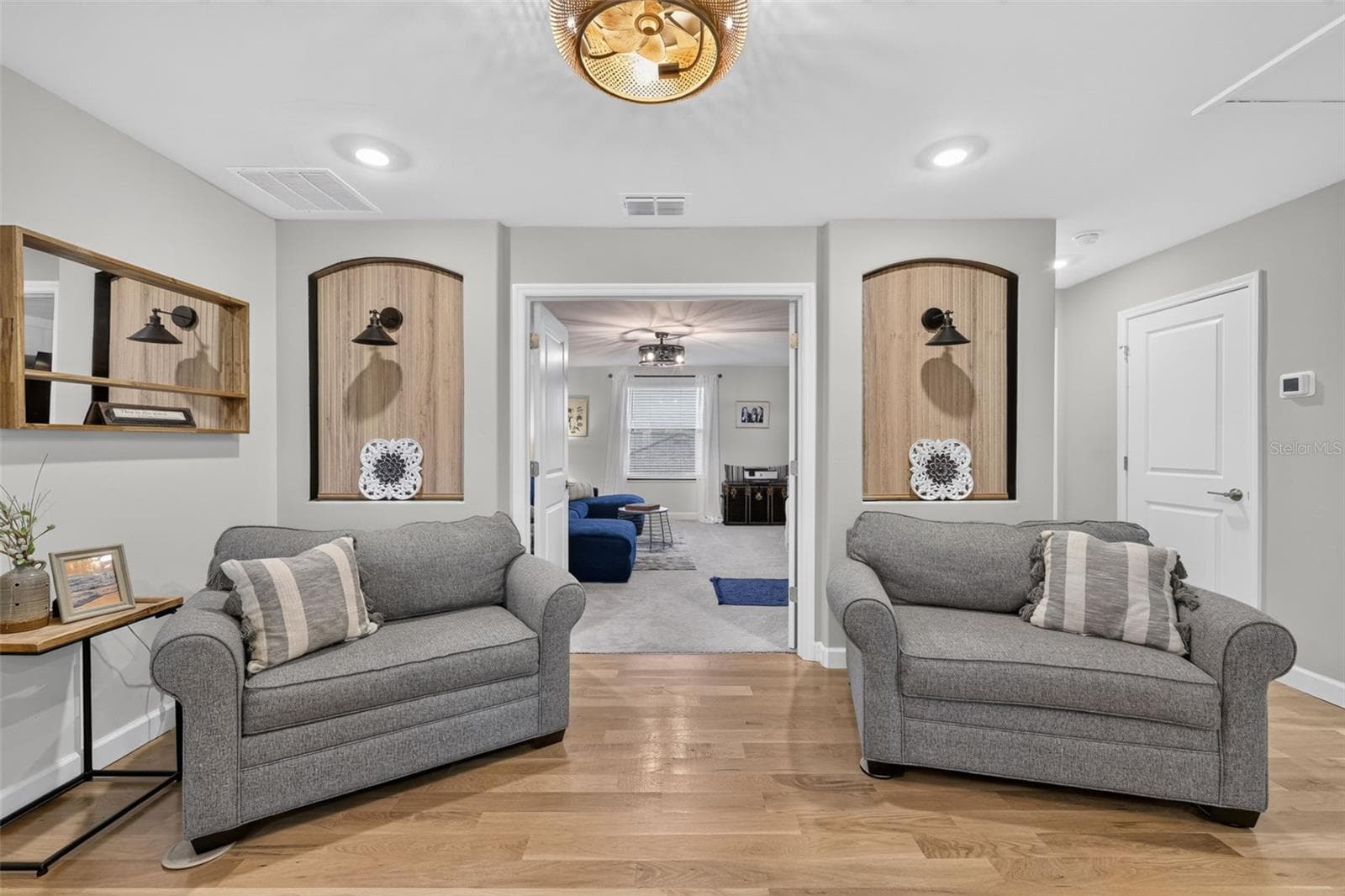 Second Floor Sitting Area with White Oak Flooring and Decorative Insets - 15008 MISTY WATER XING, BRADENTON