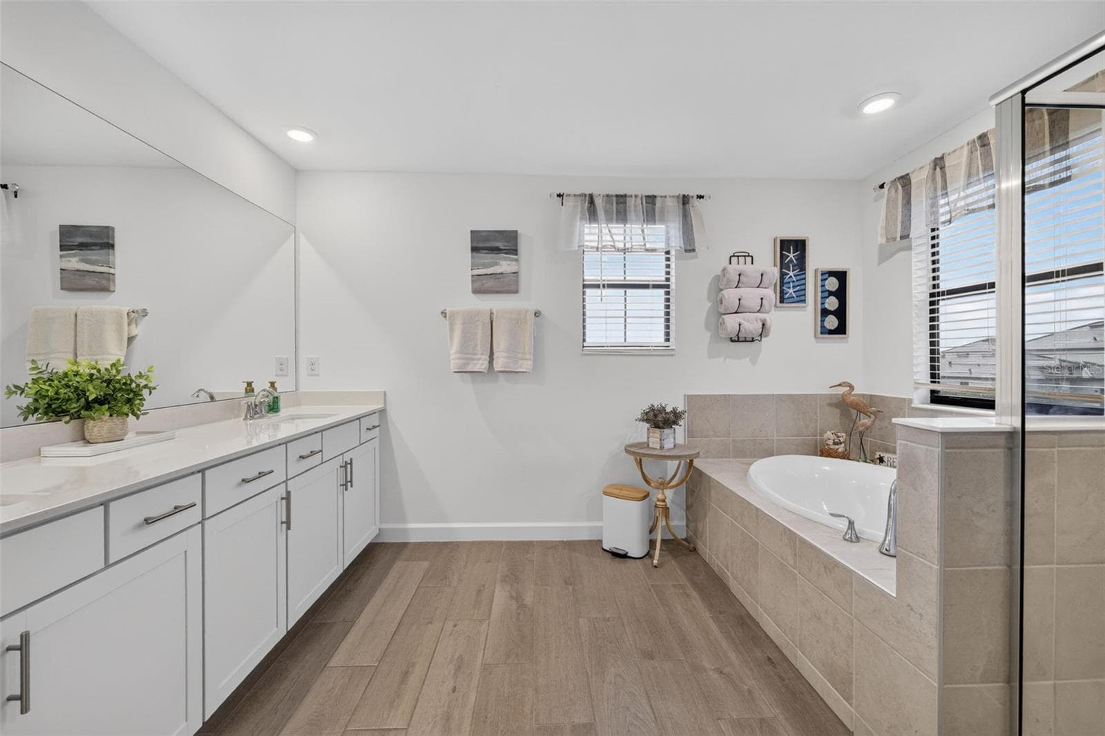 Primary Ensuite Bathroom with Garden Tub, Walk-in Shower and Quartz Counters on the Dual Vanity - 15008 MISTY WATER XING, BRADENTON