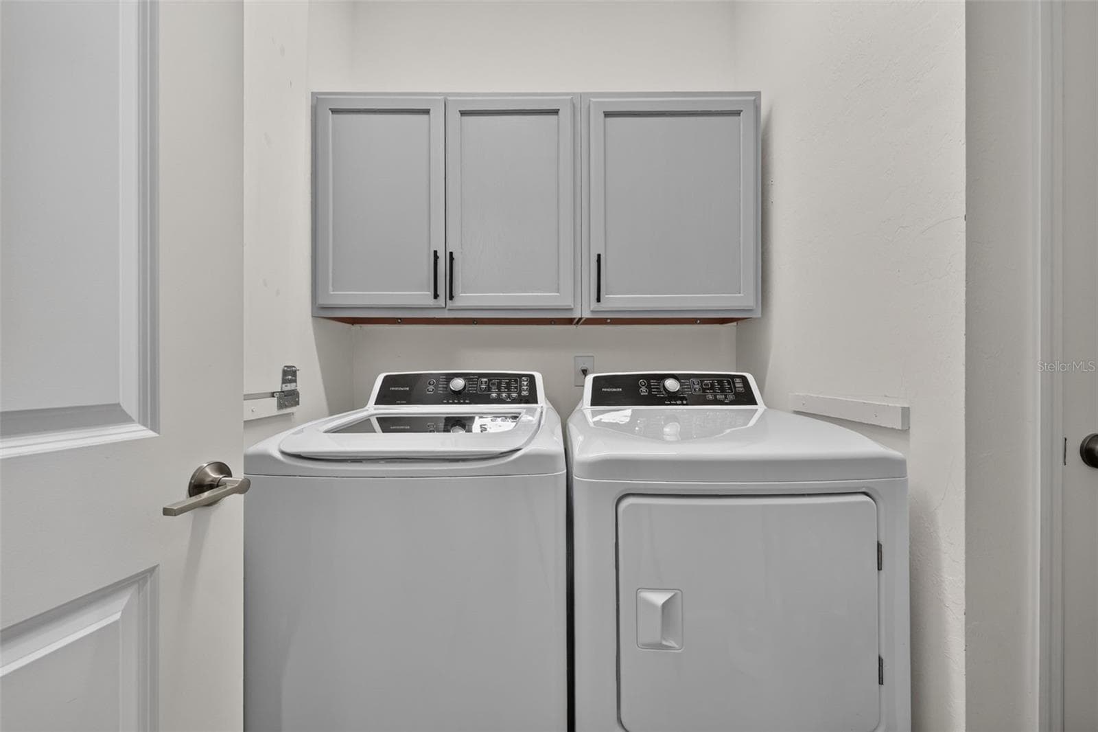 First Floor Laundry Room with Custom Cabinetry - 15008 MISTY WATER XING, BRADENTON