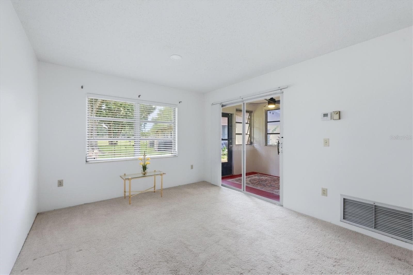 Living room area opens to covered porch - 4538 PAWNEE TRL #197, SARASOTA