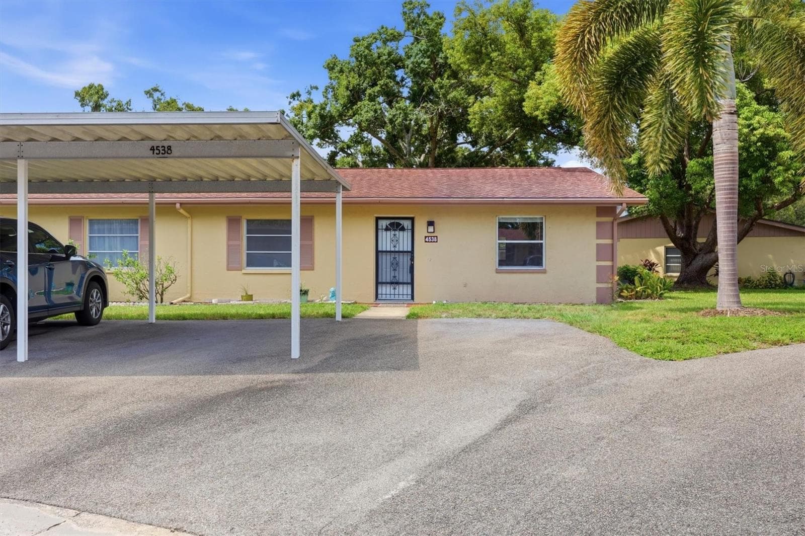 Designated carport and guest parking right out front - 4538 PAWNEE TRL #197, SARASOTA