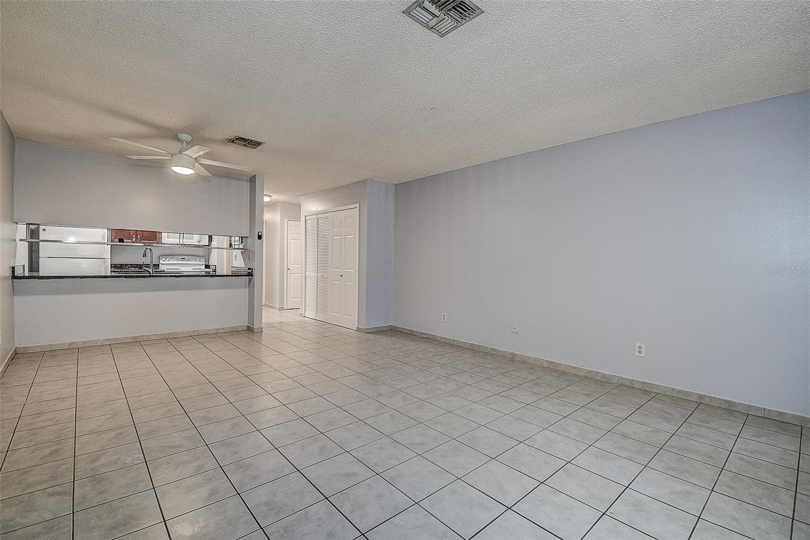 Living room to front door and bedroom hallway - 10306 COUNCILS WAY, TEMPLE TERRACE