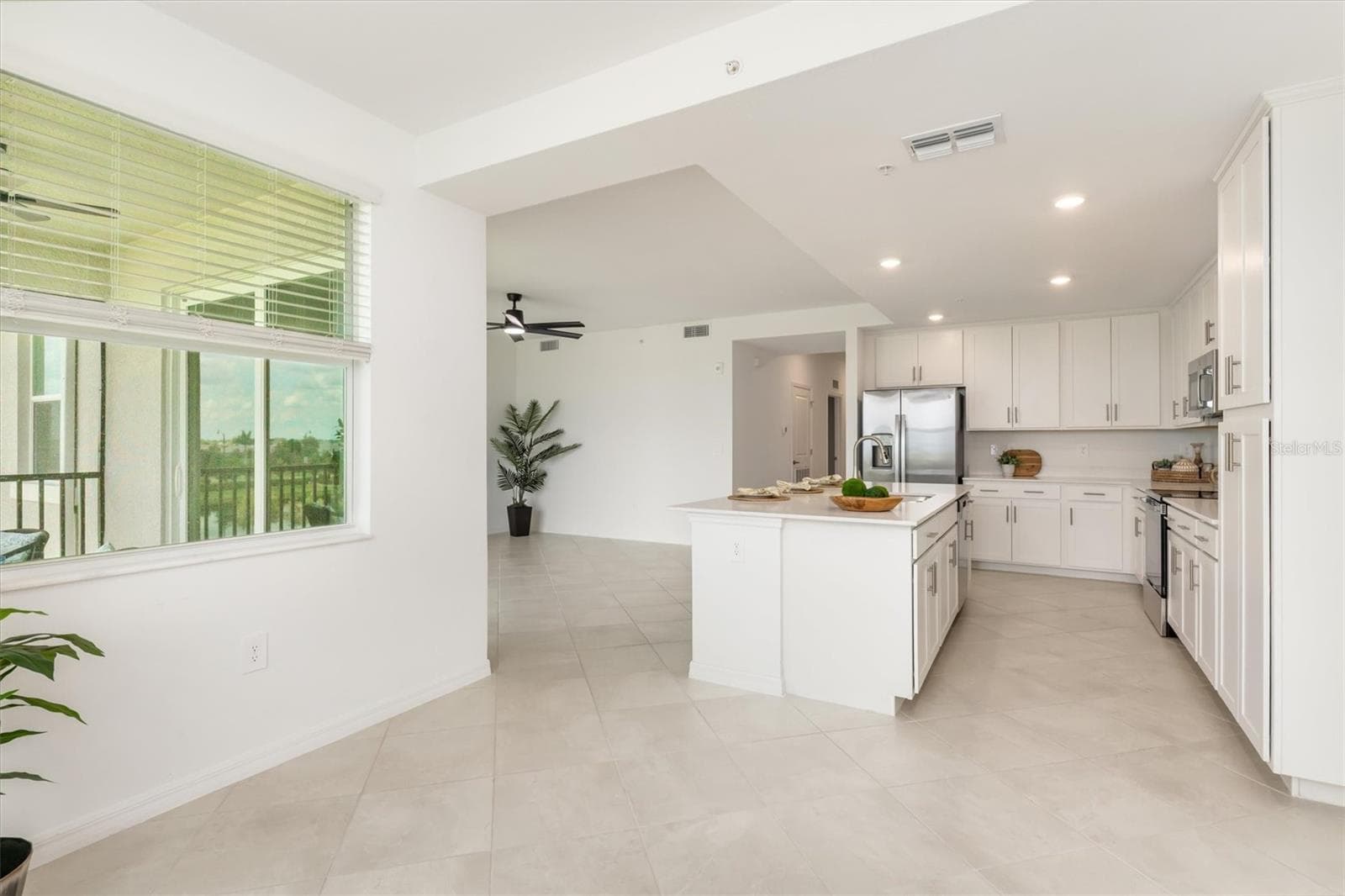 Dining room is open to kitchen & living room. - 17625 OPAL SAND DR #307, VENICE