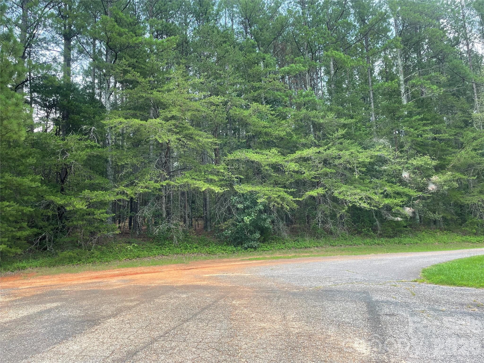 Situated on a quiet cul-de-sac along Fishermans Lane, offering a peaceful wooded setting. - 01 Fishermans Lane, Maiden