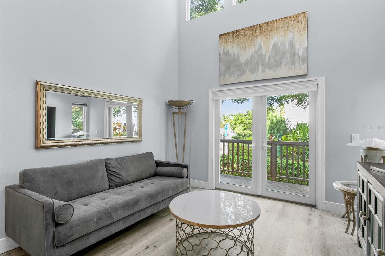 The living room is complete with new French doors that lead to your private deck. - 1116 SHIPWATCH CIR, TAMPA