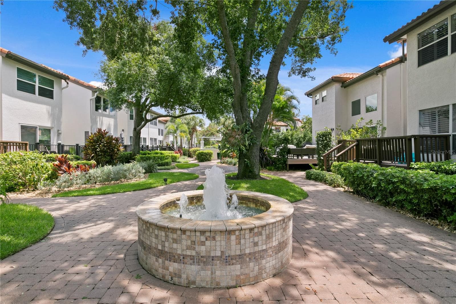 At the center of the courtyard is a peaceful fountain. - 1116 SHIPWATCH CIR, TAMPA