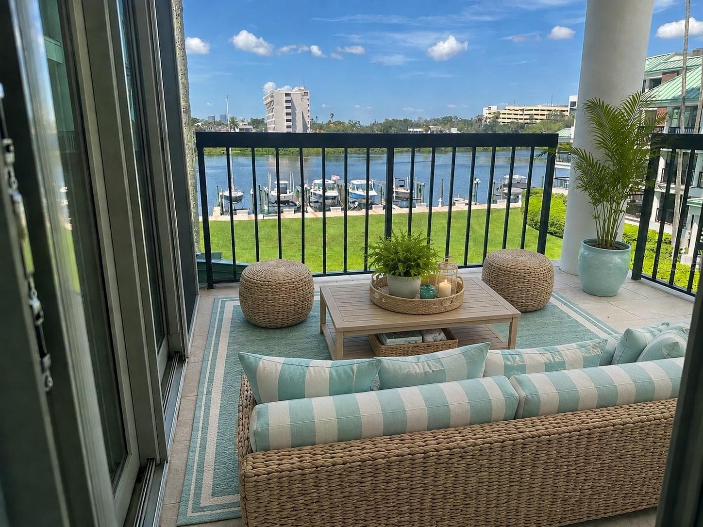 1st floor Balcony viewed from kitchen access, with doors to living room on the left. Virtually staged. - 947 SEDDON COVE WAY #947, TAMPA