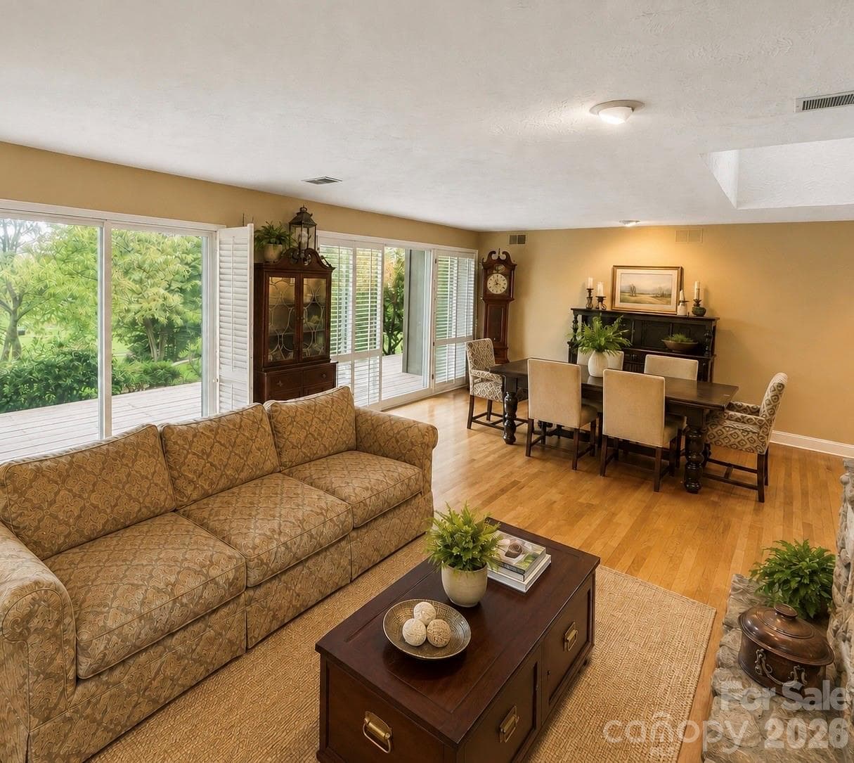 Living Room and Dining area with a wall of windows looking out to the golf course - 4821 Elmhurst Drive NE, Hickory