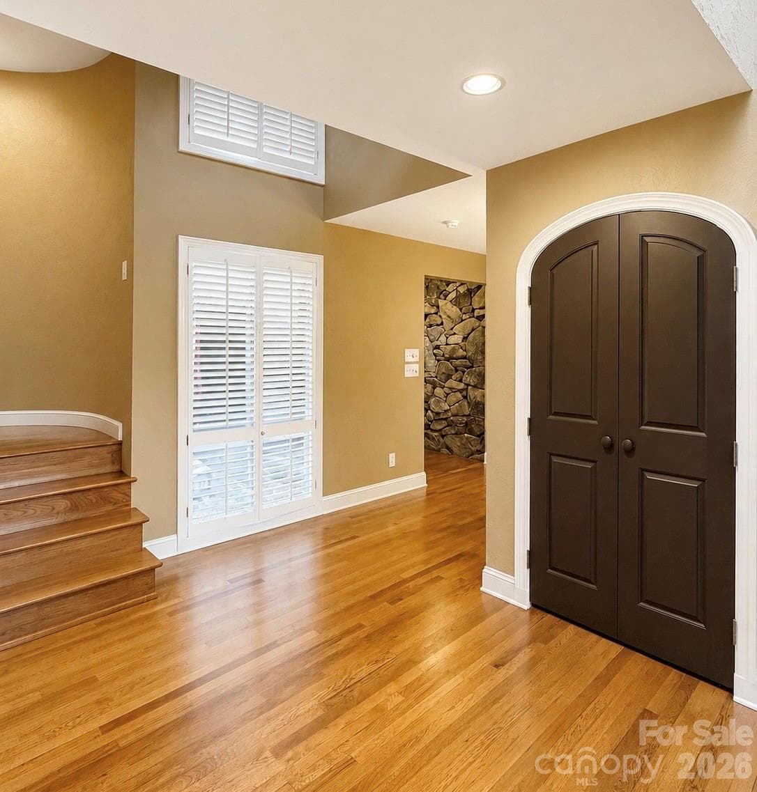Behind the arched doors is the 2nd bar located in the living room/dining area - 4821 Elmhurst Drive NE, Hickory
