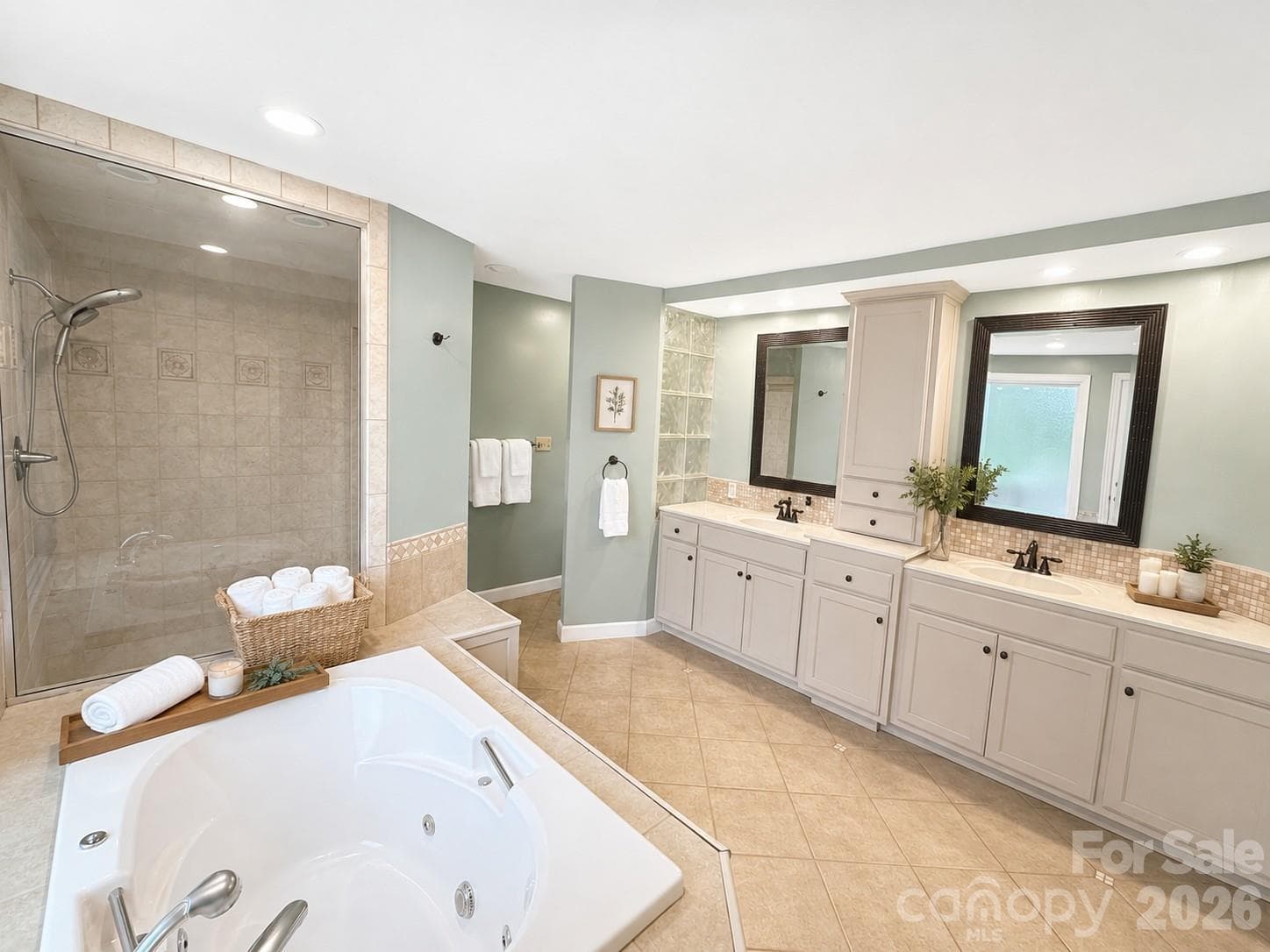 Spa like primary bath with a door to the private deck. - 4821 Elmhurst Drive NE, Hickory