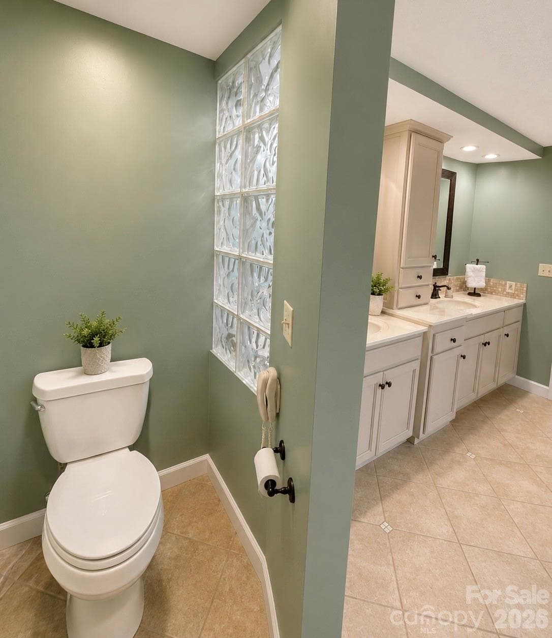 Spa like primary bath with double sink vanity, soaking tub and walk in shower. - 4821 Elmhurst Drive NE, Hickory