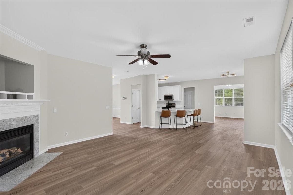 Large living room open to kitchen with extended flex room area - 8100 Laurel Run Drive, Charlotte