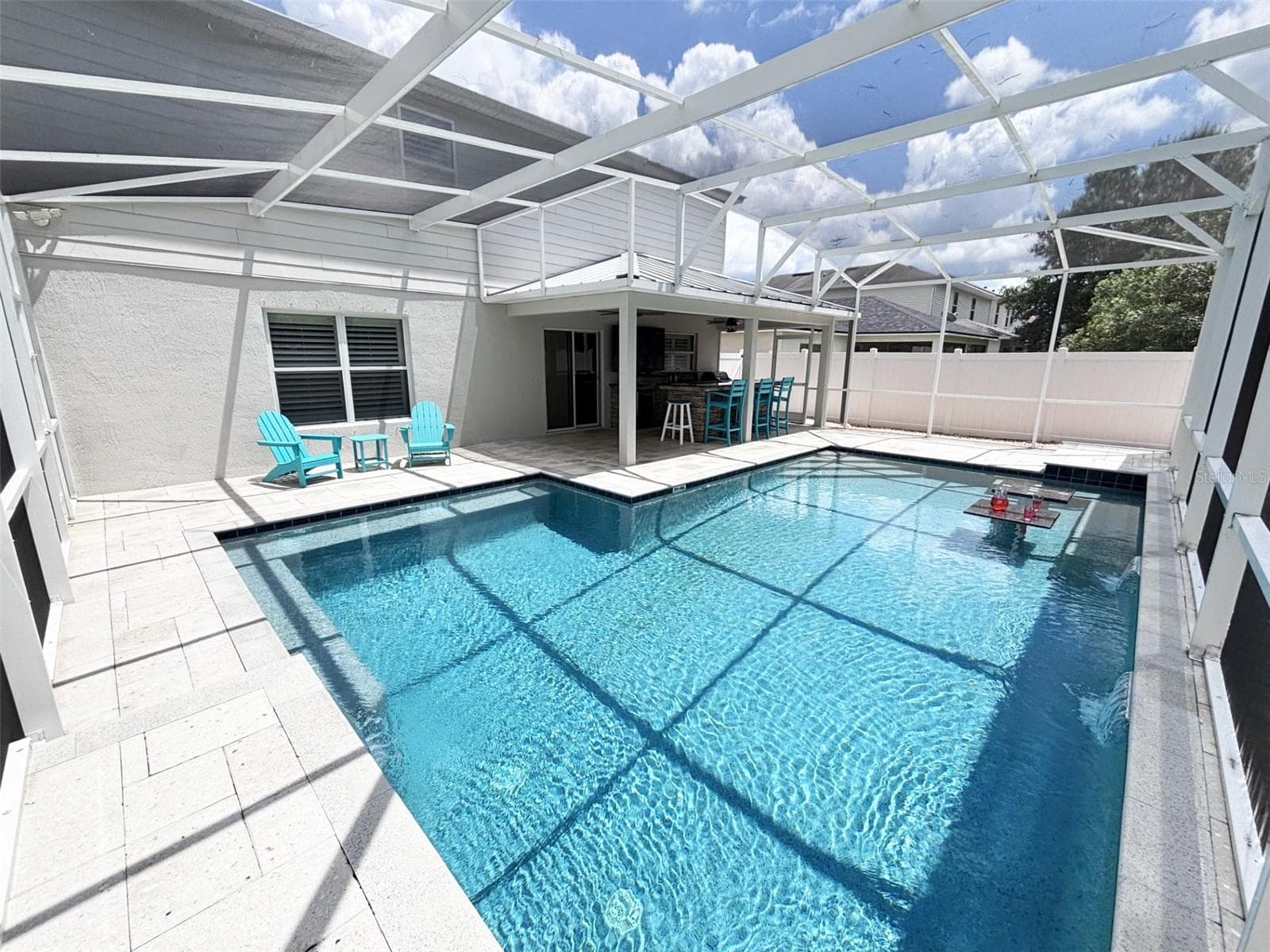 Screened pool long view - 552 AEOLIAN DR, NEW SMYRNA BEACH