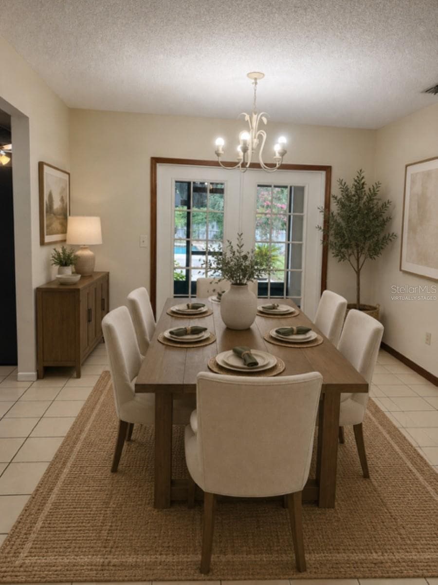 Dining room virtually staged - 226 COUNCIL BLUFFS DR, DELTONA