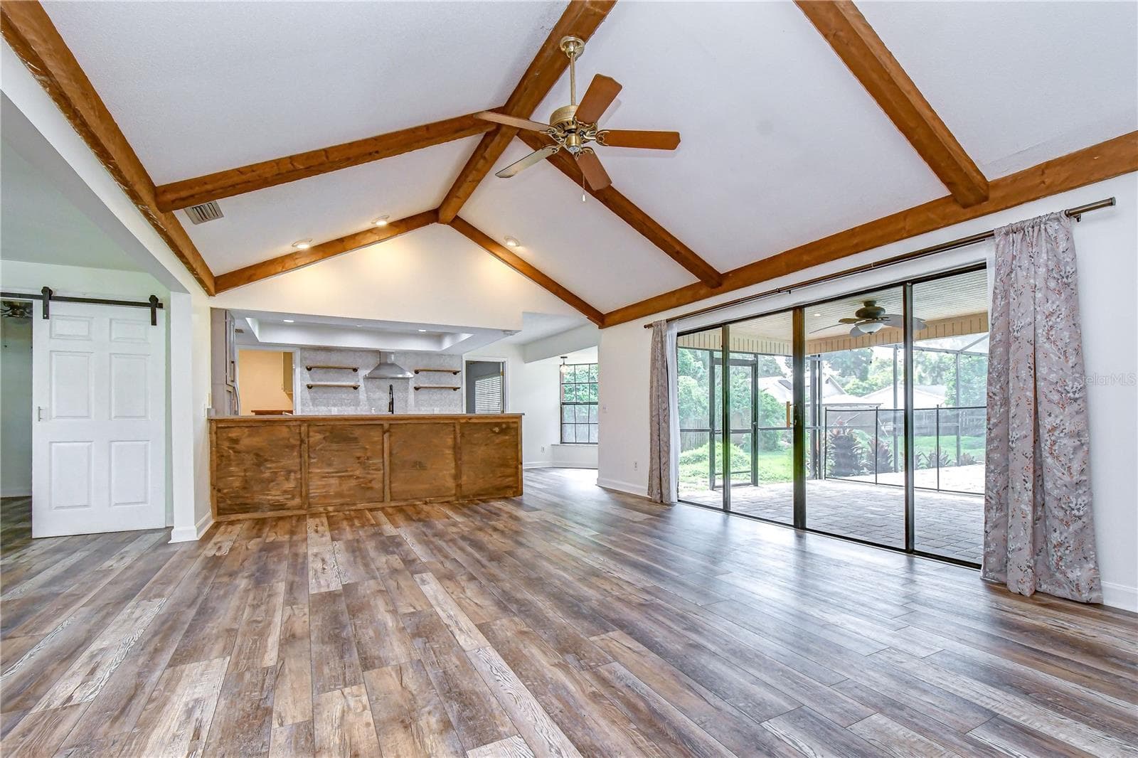 Updated flooring flows throughout the main living areas for a cohesive look - 1101 OAKRIDGE MANOR DR, BRANDON