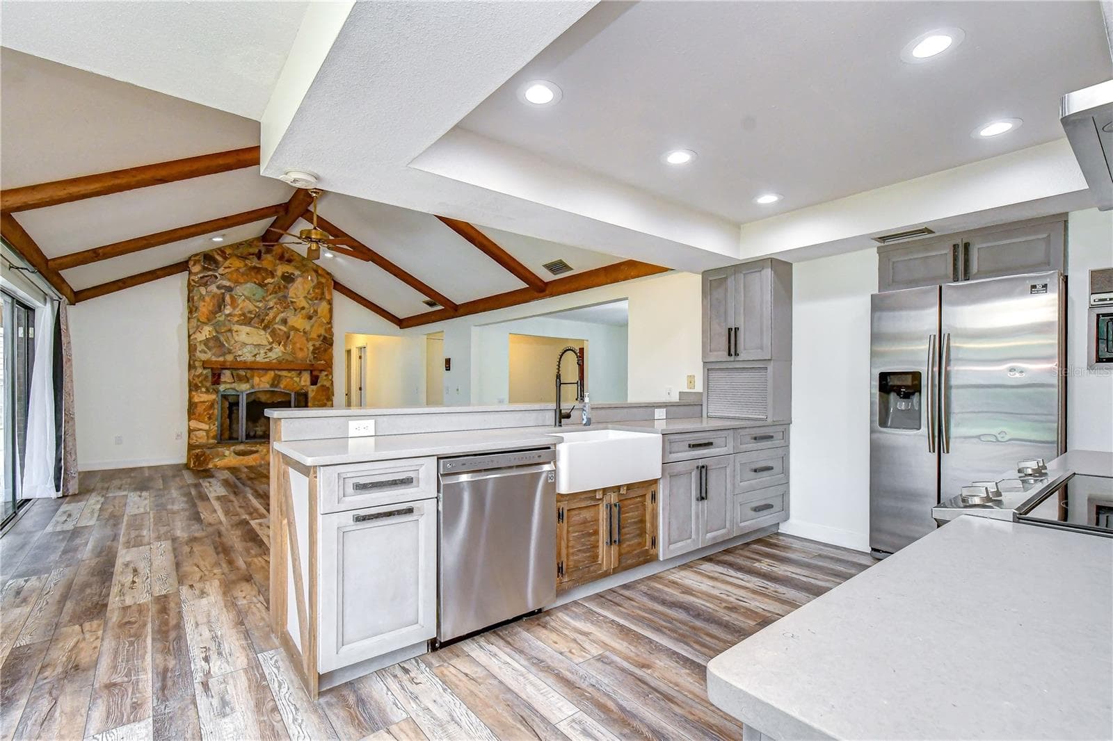 Open-concept design keeps the kitchen connected to the main gathering spaces - 1101 OAKRIDGE MANOR DR, BRANDON