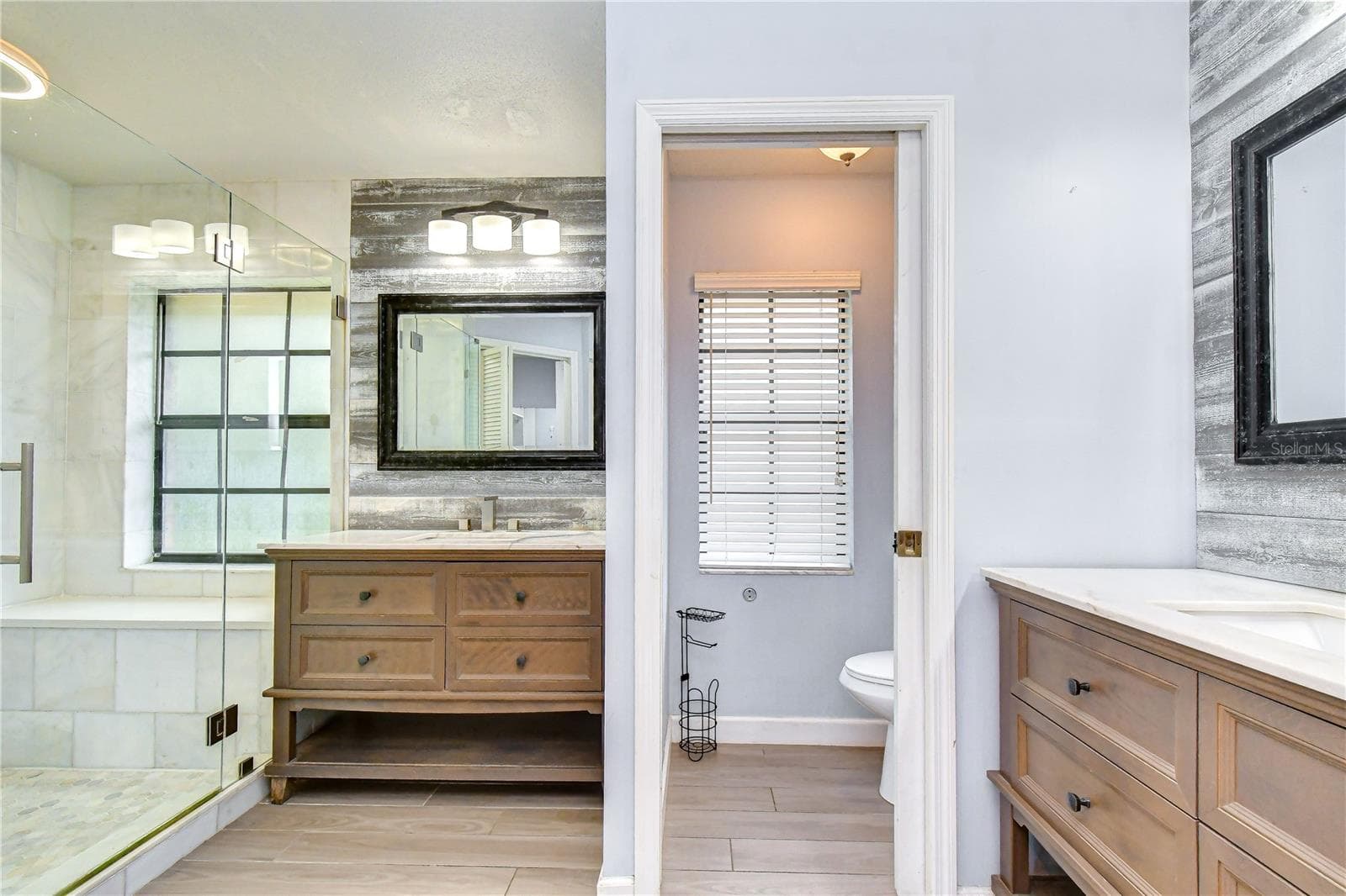 Features dual vanities and a beautiful seamless glass shower - 1101 OAKRIDGE MANOR DR, BRANDON