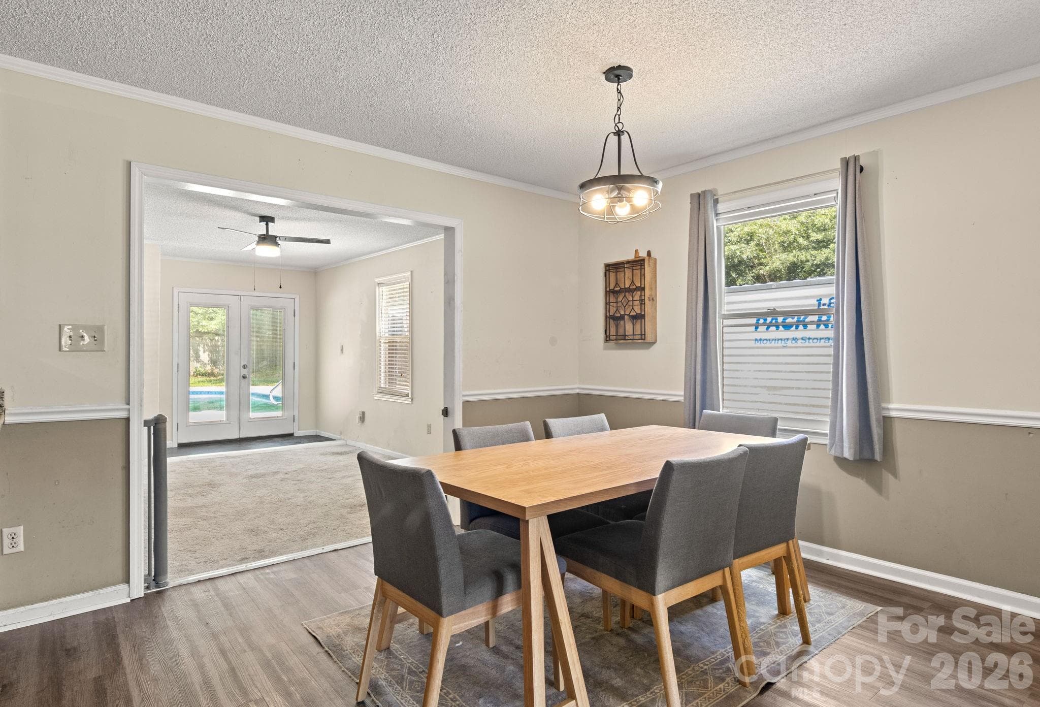 Dining area with entry into bonus room and doors leading to backyard and pool - 1820 Bridgewood Drive, Lancaster