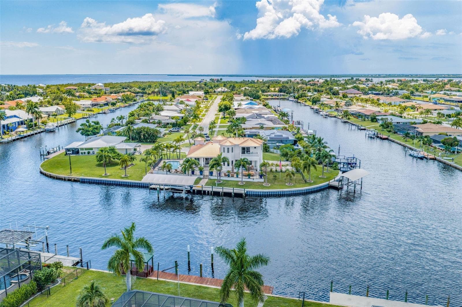Stunning Aerial Highlighting Pool, Outdoor Living Areas and Waterfront Access - 290 TAIT TER SE, PORT CHARLOTTE