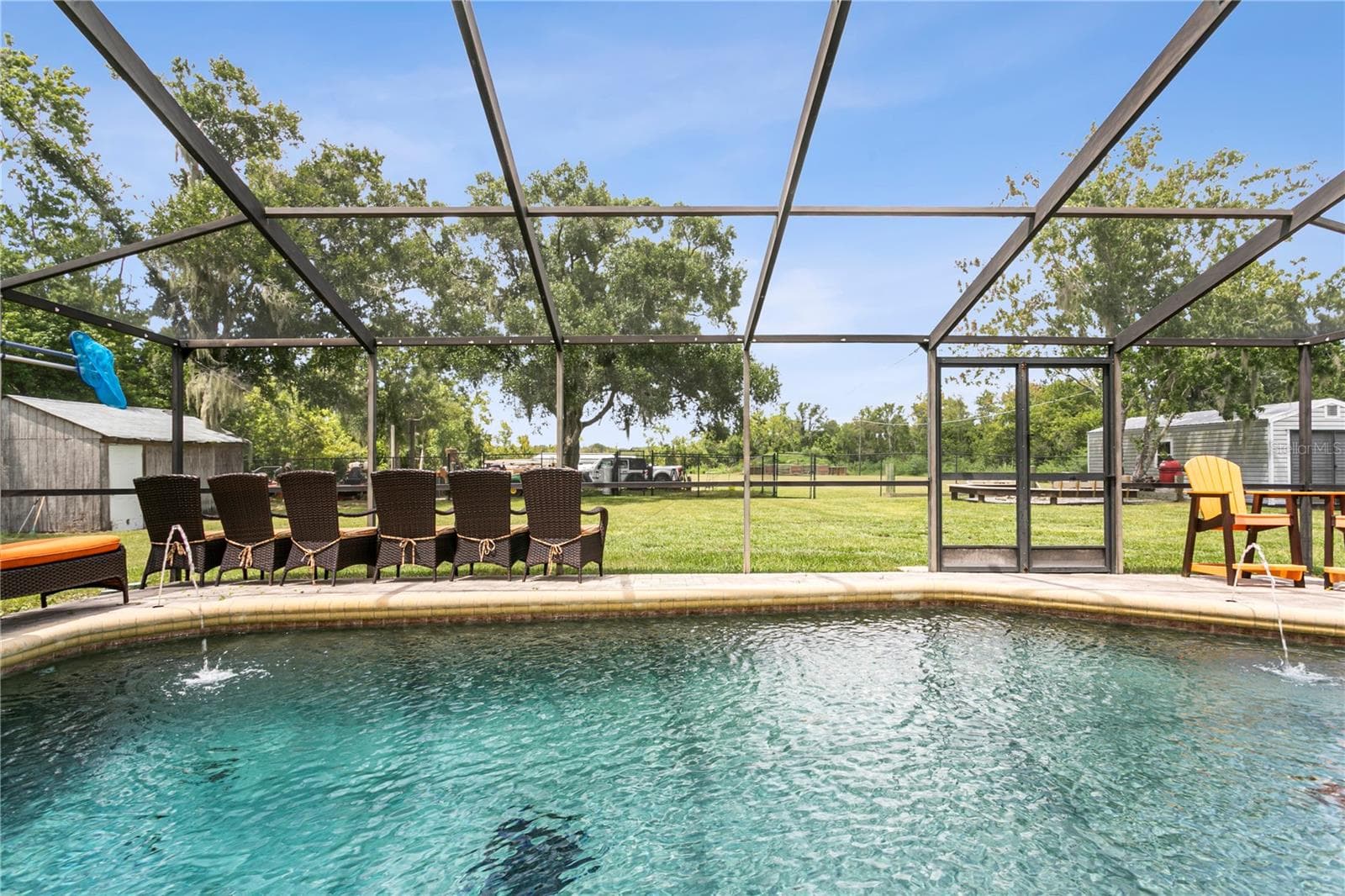 Pool overlooking huge backyard - 10710 BILL TUCKER RD, WIMAUMA