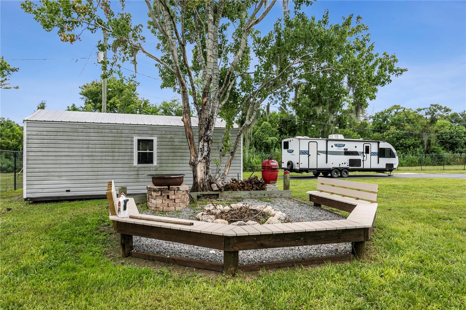 Fire pit area and one of the outbuildings - 10710 BILL TUCKER RD, WIMAUMA