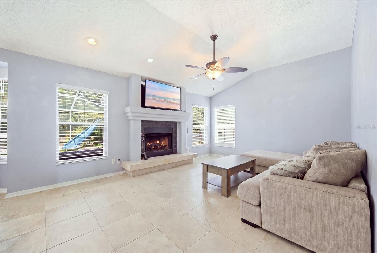 Living Room w/ Wood Burning Fireplace - 28707 RALEIGH PL, WESLEY CHAPEL