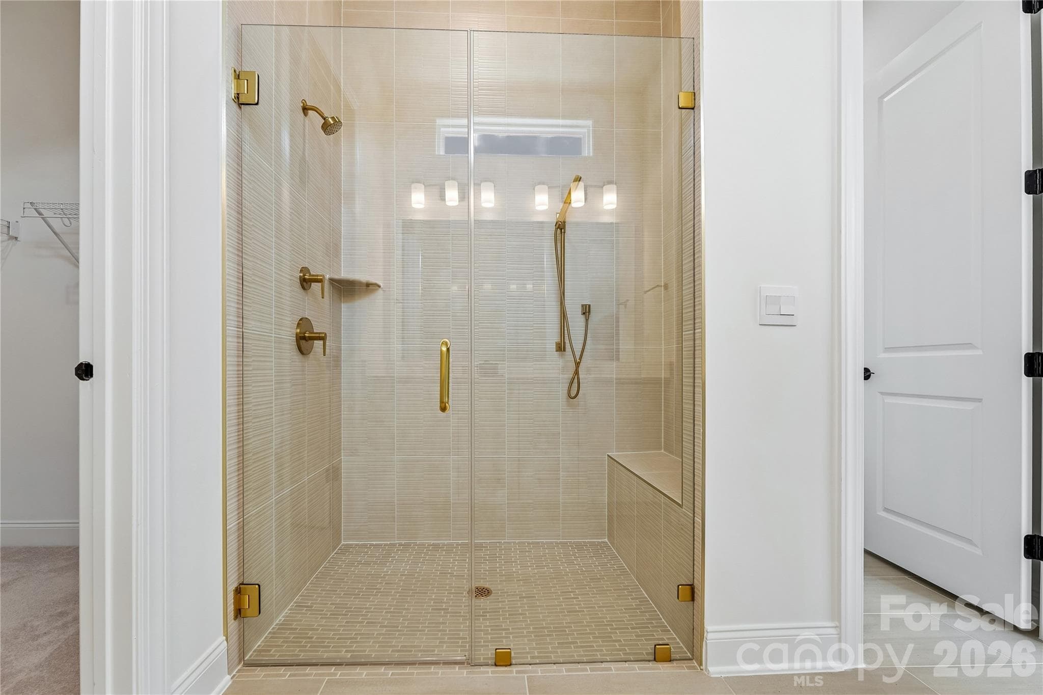 Primary bathroom zero entry shower virtually staged - 2250 Whitebark Drive, Indian Land