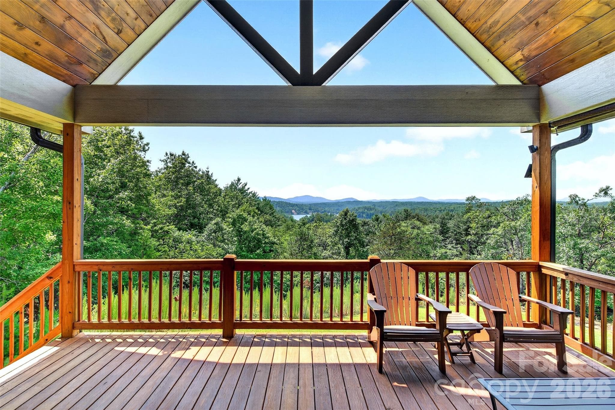Covered rear porch under a vaulted timber ceiling; year-round mountain and lake views - Nebo