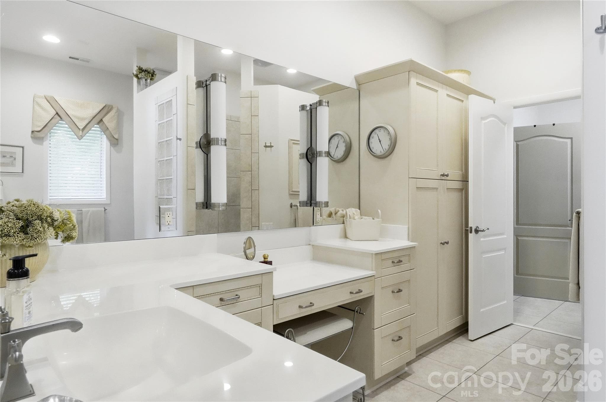 Primary bath boasts dual vanities. - 1075 Lakefront Woods Drive, Belmont