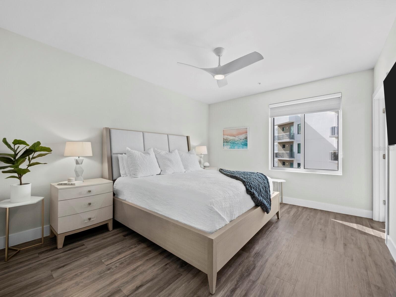 Spacious primary bedroom with plenty of natural light and room for king bed - 1709 N TAMIAMI TRL #418, SARASOTA