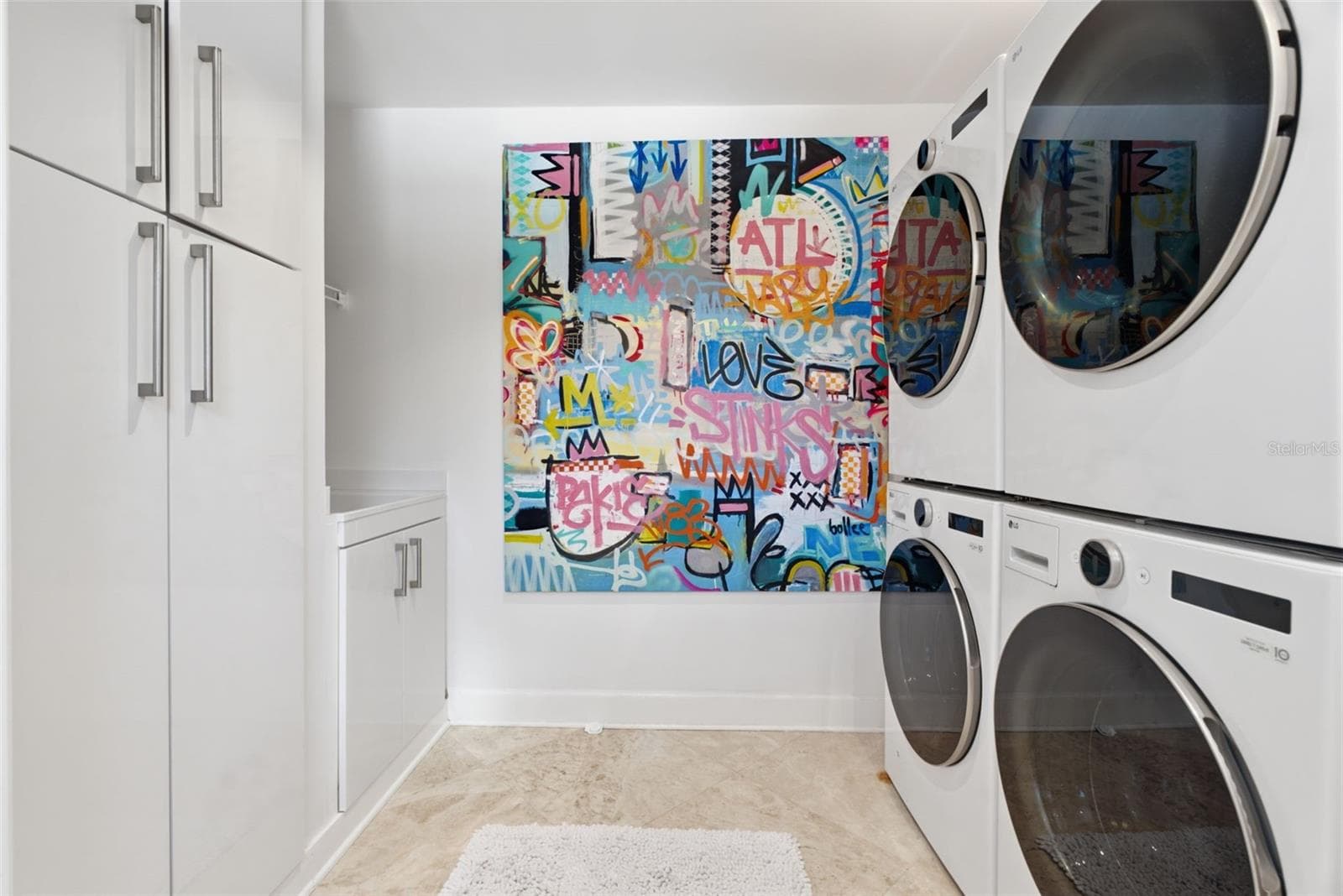 Laundry room with sink, dual washer/dryer space - 2701 CHAMBRAY LN, TAMPA