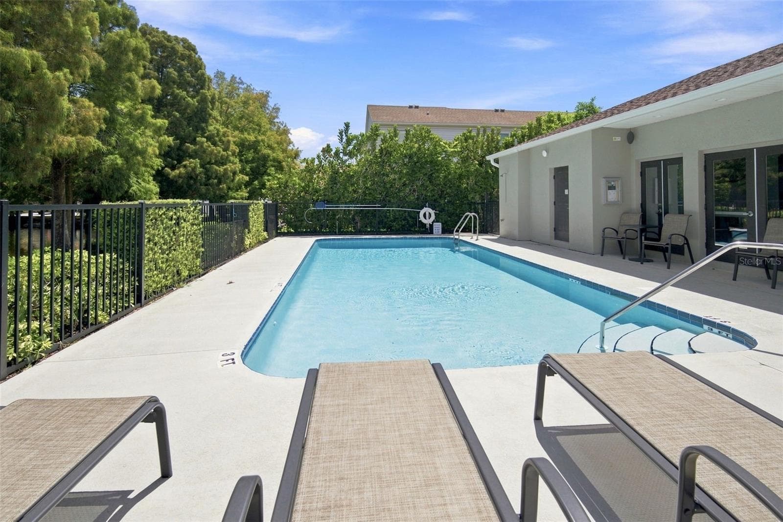 Pool is directly across from the lake and Guest parking. - 5292 NEIL DR, ST PETERSBURG