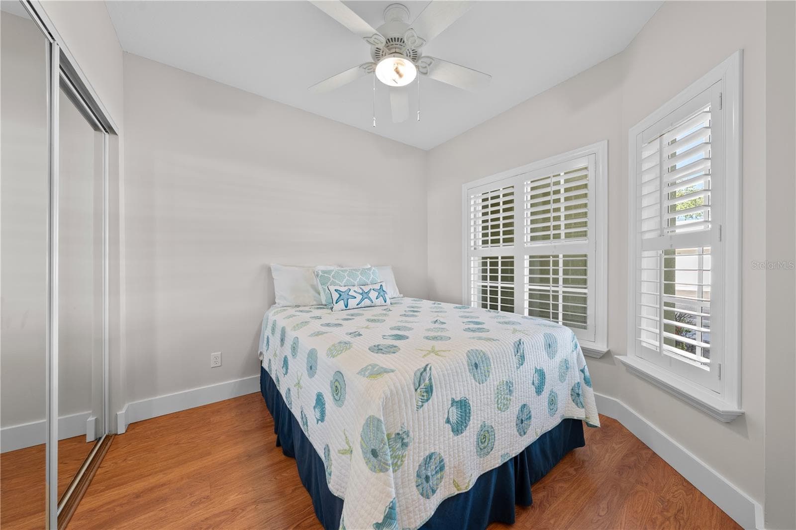 Bedroom 3 with beautiful plantation shutters and freshly painted with upgraded baseboards. - 13570 MYSTIC DR #102, SEBASTIAN