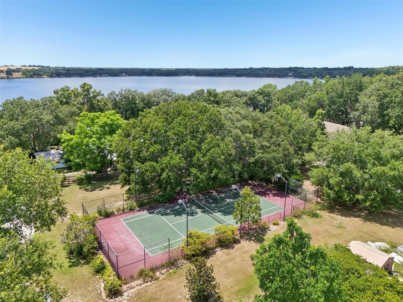 Regulation sports court is lighted & fenced - 18249 ROSE ST, GROVELAND