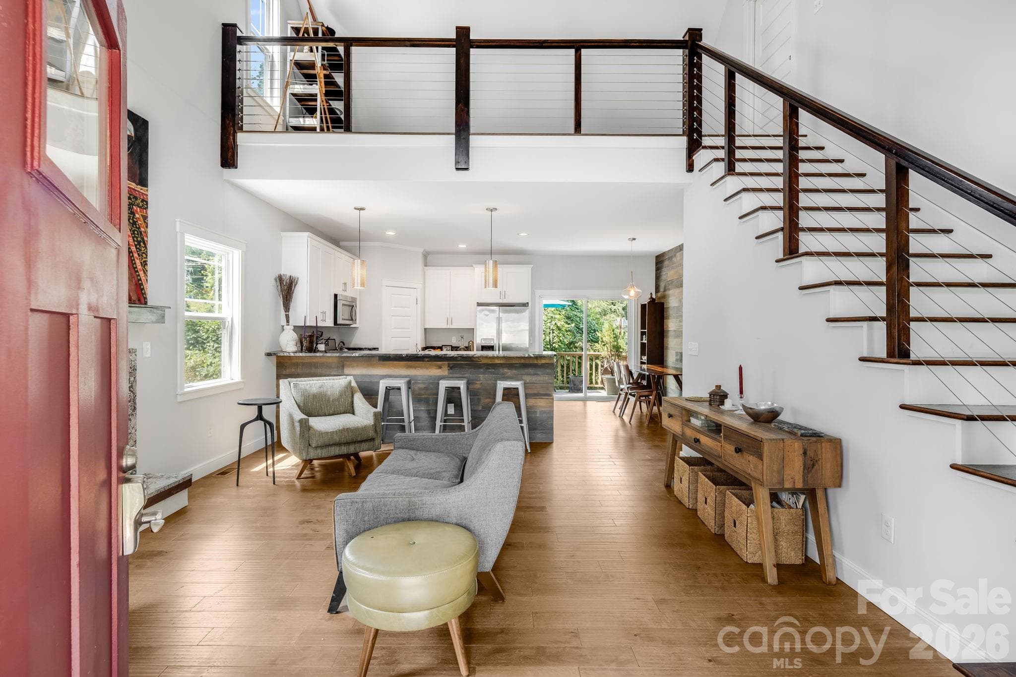 Open concept, with high ceilings and a gas fireplace. - 35 Emmett Lane, Asheville