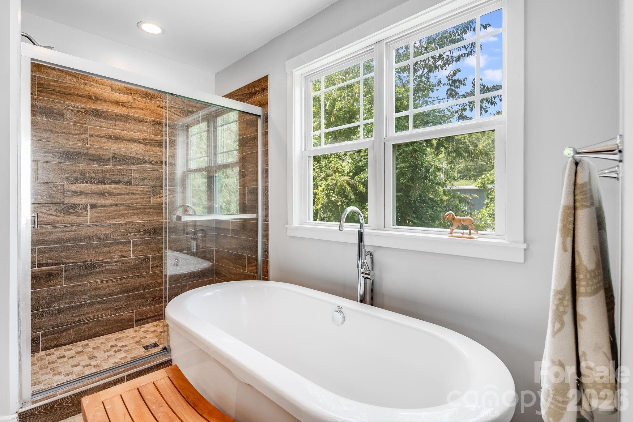 Primary bath has a very stylish shower and garden tub combo. - 35 Emmett Lane, Asheville