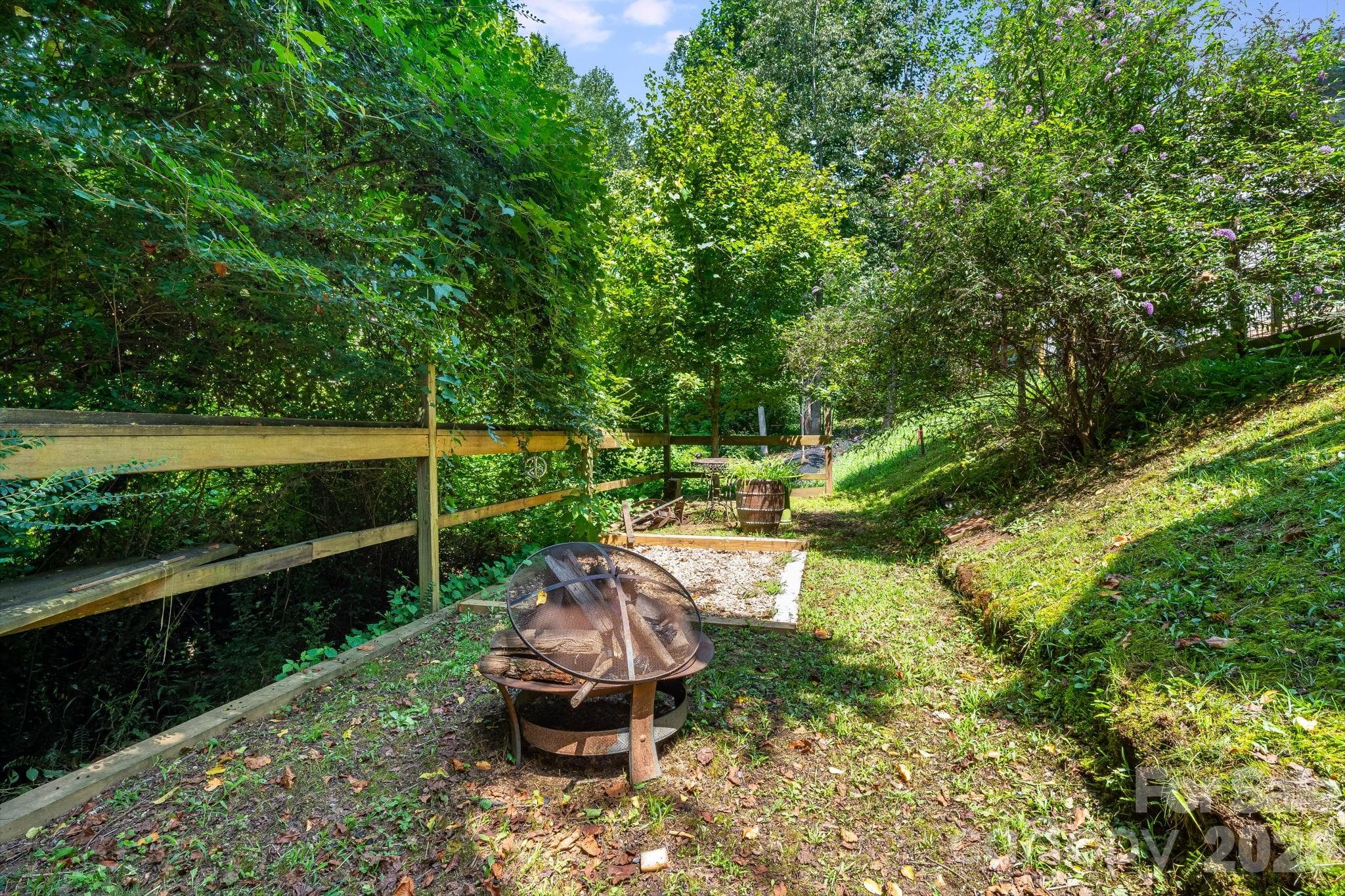 Finish the fence for your furry friend. Fire pit area and potential garden area. - 35 Emmett Lane, Asheville