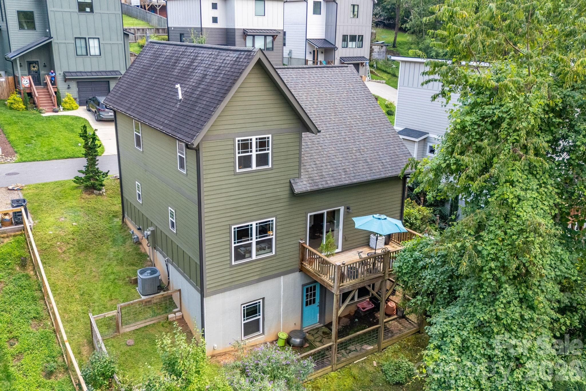 1.5 stories and a full daylight basement. Basement is framed and plumbed with electric and ductwork accessible. Homestays/ STR  are allowed here. Buyer to verify. - 35 Emmett Lane, Asheville