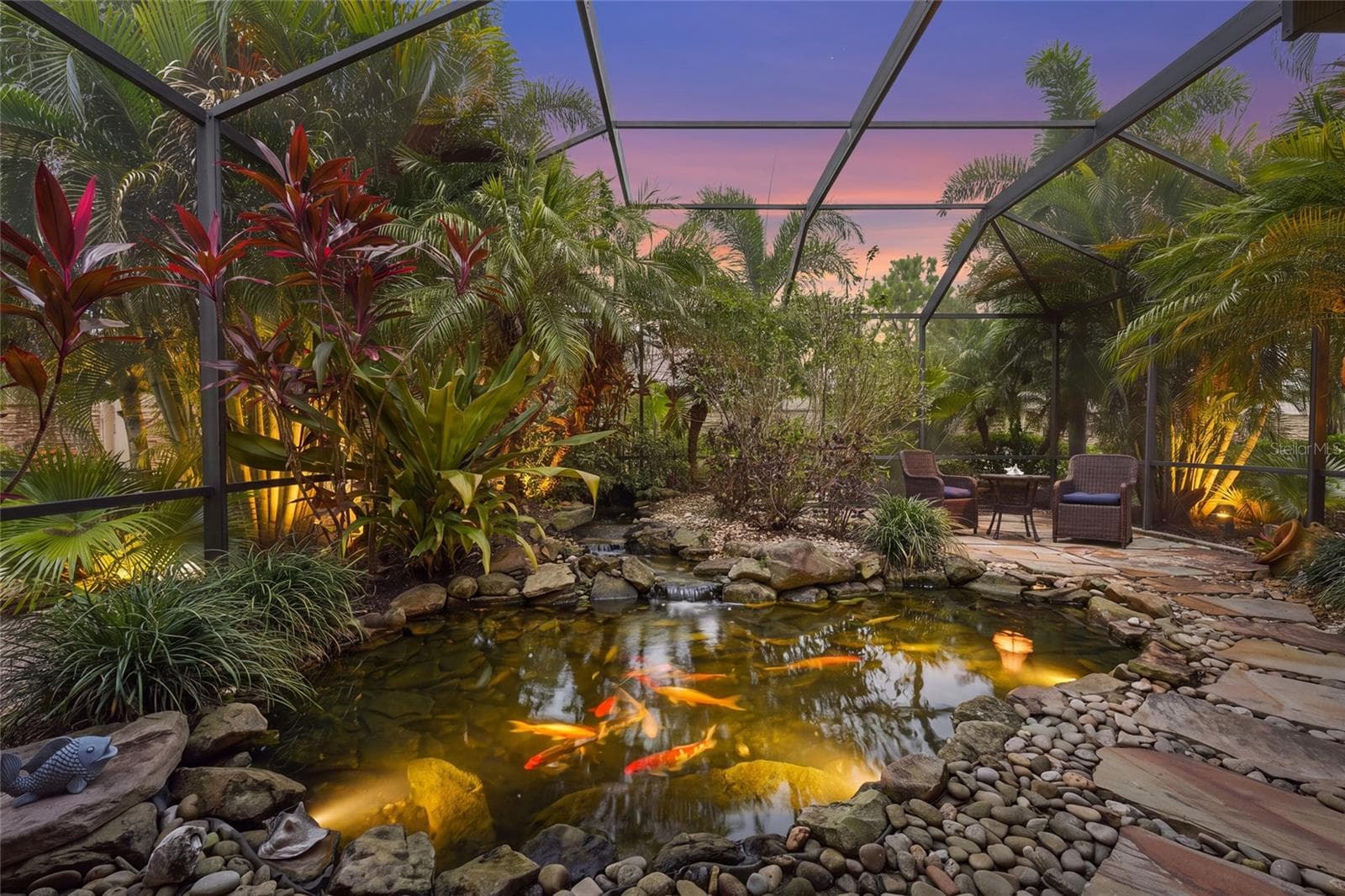 Beautiful, lush outdoor lanai with koi pond - 13223 PALERMO DR, BRADENTON
