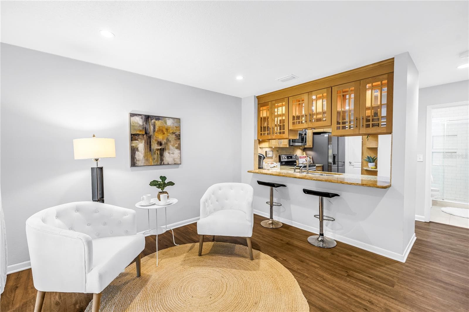 Sophisticated Kitchen and Lounge area opens to screened porch and expansive grassy fenced yard - 1092 SANABEL CT NE, ST PETERSBURG