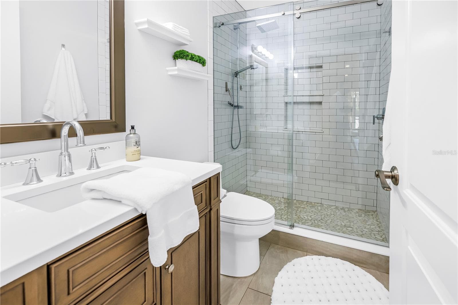 Fully Updated First Floor Full Bath.  Very nice Glass Enclosure, shower and fixtures - 1092 SANABEL CT NE, ST PETERSBURG