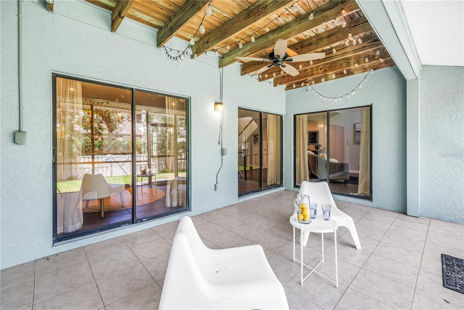 Downstairs Sliders Open Interior to Screened Covered back patio and Grassy Backyard maintained by the HOA - 1092 SANABEL CT NE, ST PETERSBURG