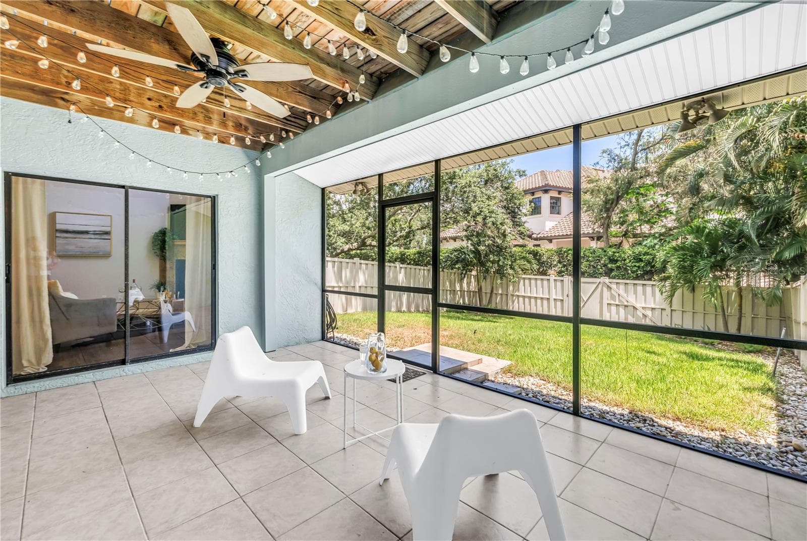 Fully Screened Back Porch accesses the fenced yard for Recreation and Pets. - 1092 SANABEL CT NE, ST PETERSBURG