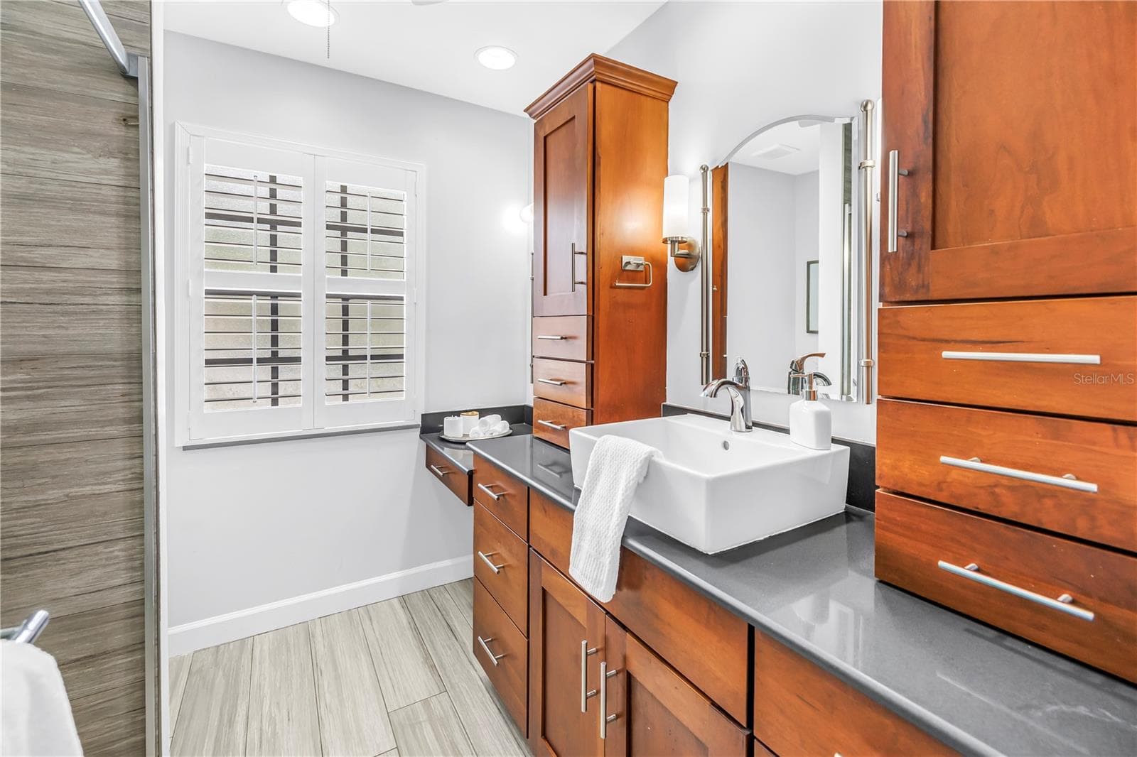 Primary Suite Vanity with dual storage units for bath products.  Modern Sink, Granite Counters - 1092 SANABEL CT NE, ST PETERSBURG