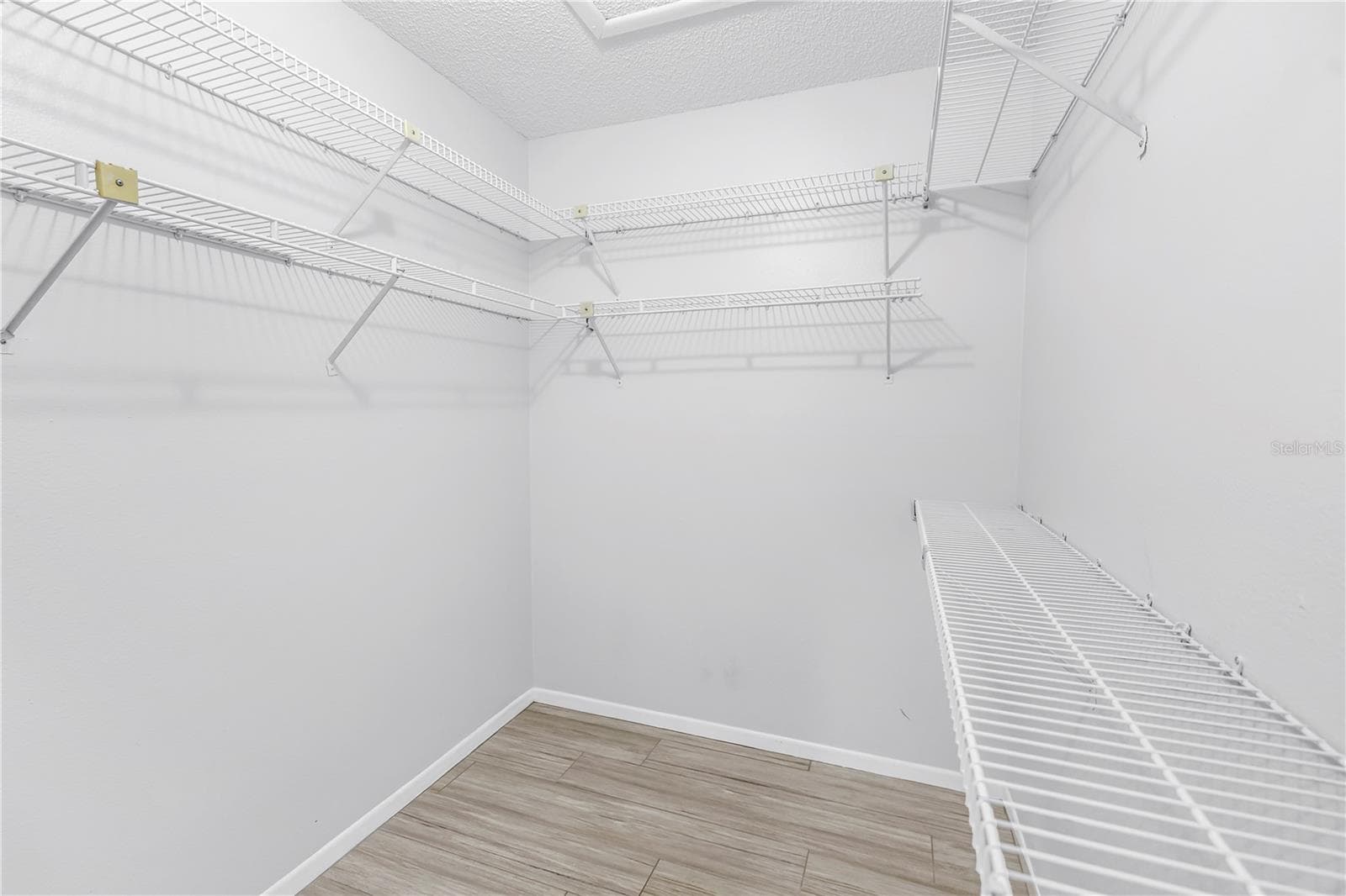 Upstairs Primary en Suite closet is expansive for 2 - 1092 SANABEL CT NE, ST PETERSBURG