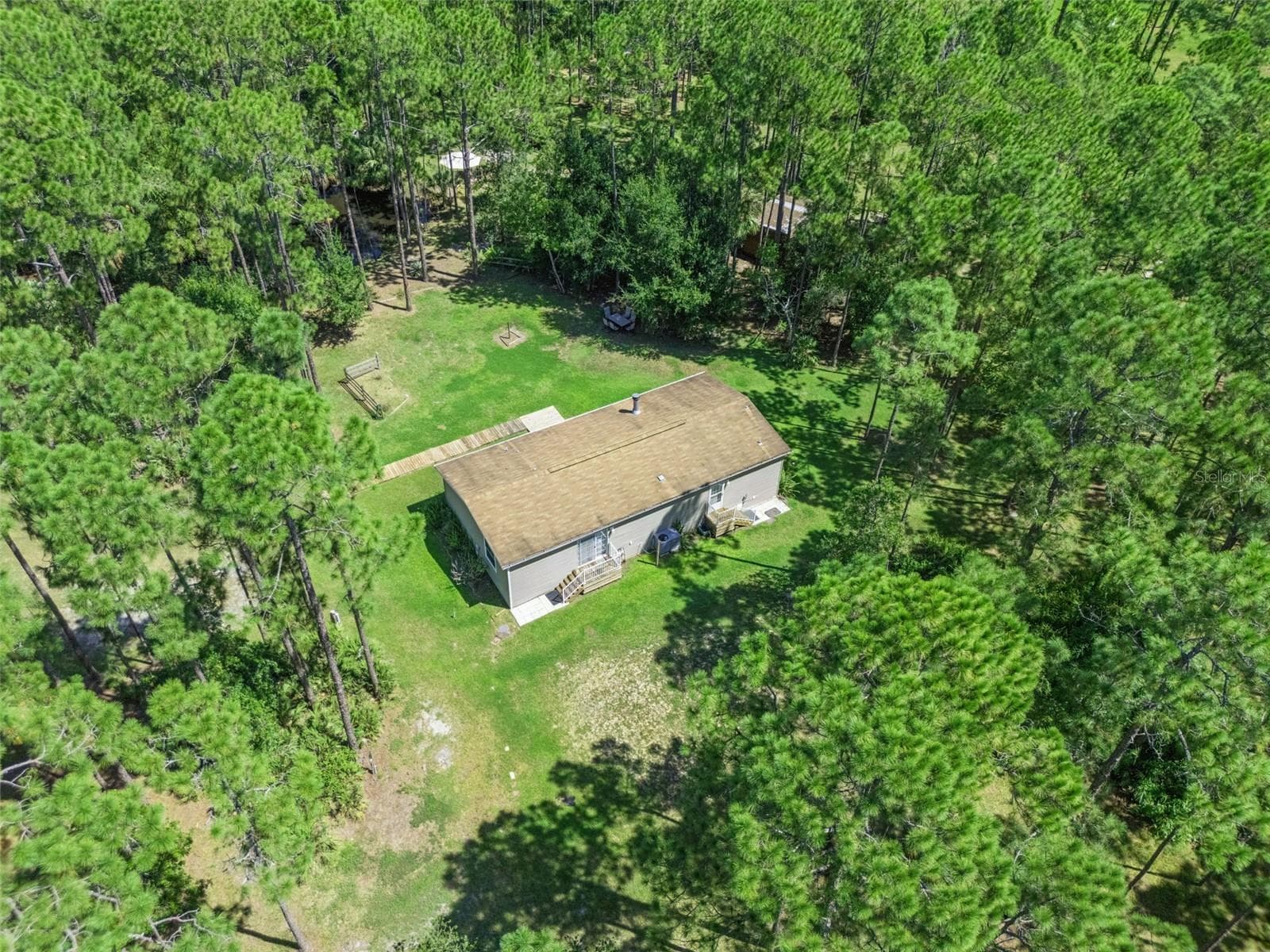Manufactured Home at 1161 LAKE HARNEY WOODS BLVD, MIMS, photo 27 of 35