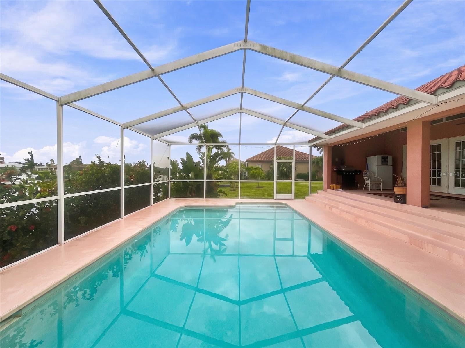SPACIOUS MARCITE POOL WITH STEPS ON SHALLOW END AND APPX 7' DEEP.dOC - 936 ALLEGRO LN, APOLLO BEACH